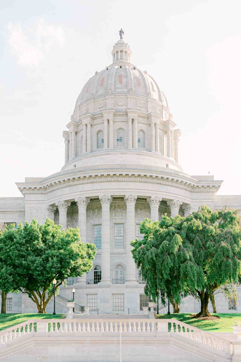 Missouri State Capitol building in Jefferson City, captured with a film-like quality, showcasing deep colors and a hint of magenta for a romantic style.