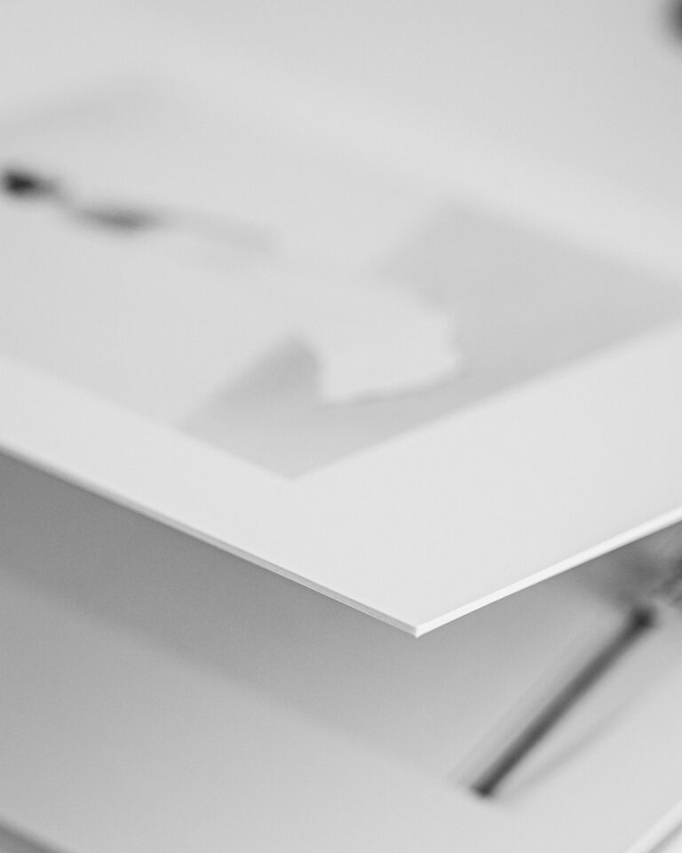 Detail of a thick layflat wedding album page showing seamless binding and archival paper.