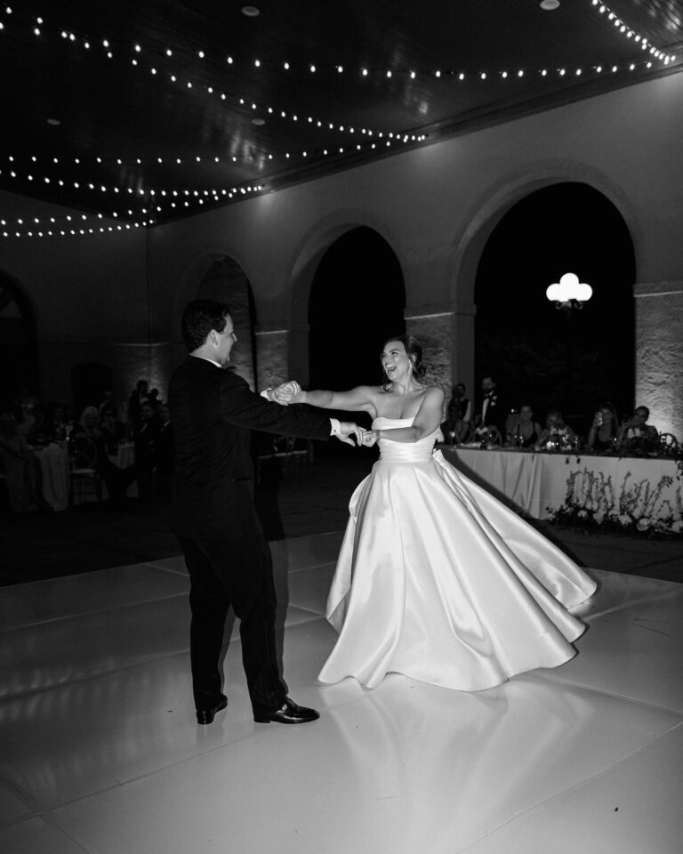 Bride and groom sharing their first dance at the Forest Park World’s Fair Pavilion in St. Louis, captured in black and white.