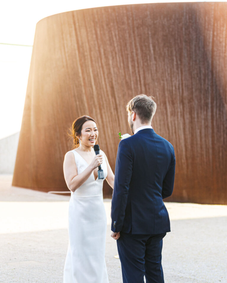 Bride reading her vows to the groom during an outdoor wedding ceremony at the Pulitzer Arts Foundation and Contemporary Art Museum in St. Louis.